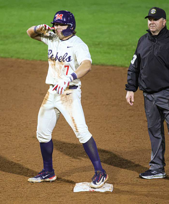 Ole Miss shortstop Luke Hill stands at second base after his two-run double in the sixth inning.